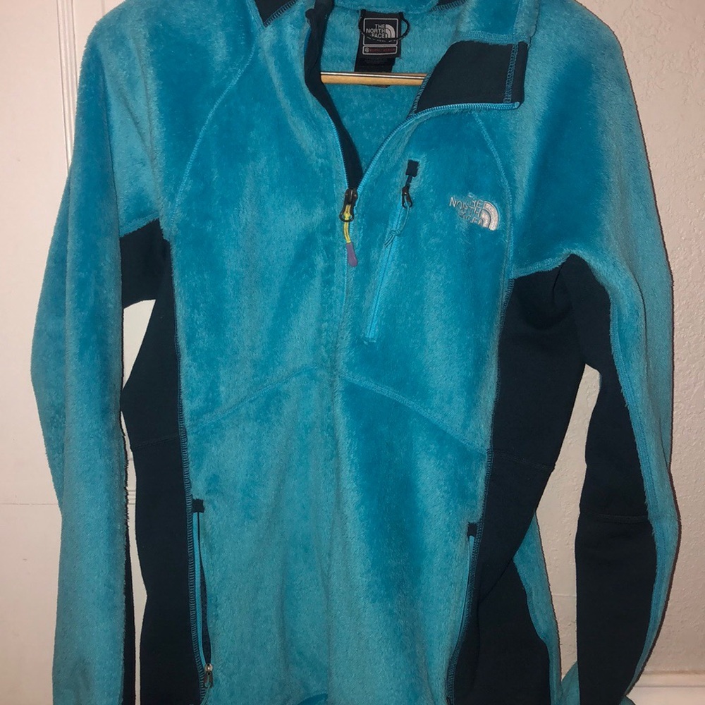Blue fuzzy north face jacket